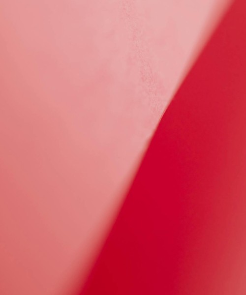 A minimalist abstract background featuring layered red tones, perfect for design and art projects.